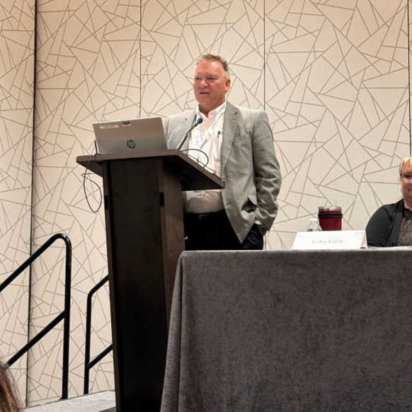 Jim Rogers giving a presentation at the Schools, Health & Libraries Broadband Coalition annual conference.